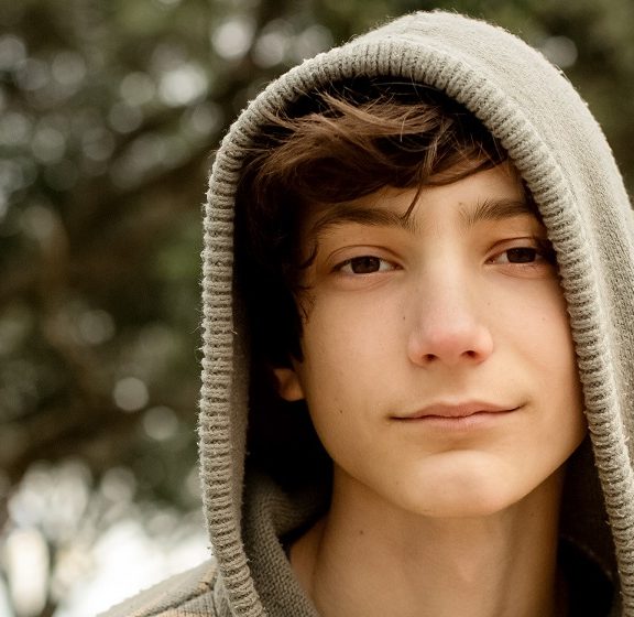 portrait of teenager boy on natural background